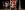2018_LAIT_I Am England_SevenArts_Photo_MSpadafora Eight young adults stand in a group facing forwards under stage lighting, in front of a Union Jack flag