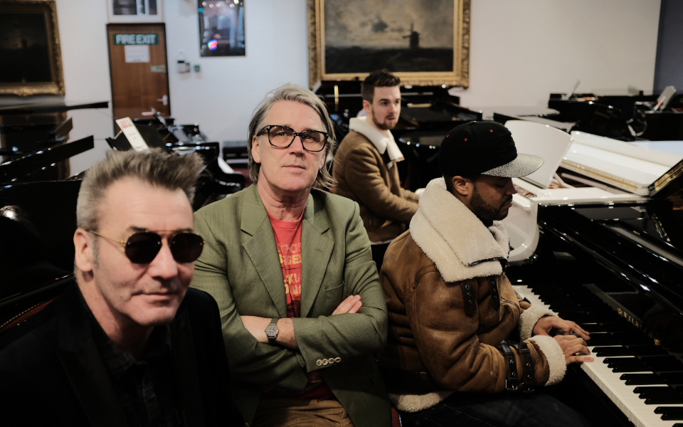 China Crisis The band China Crisis posing by a piano