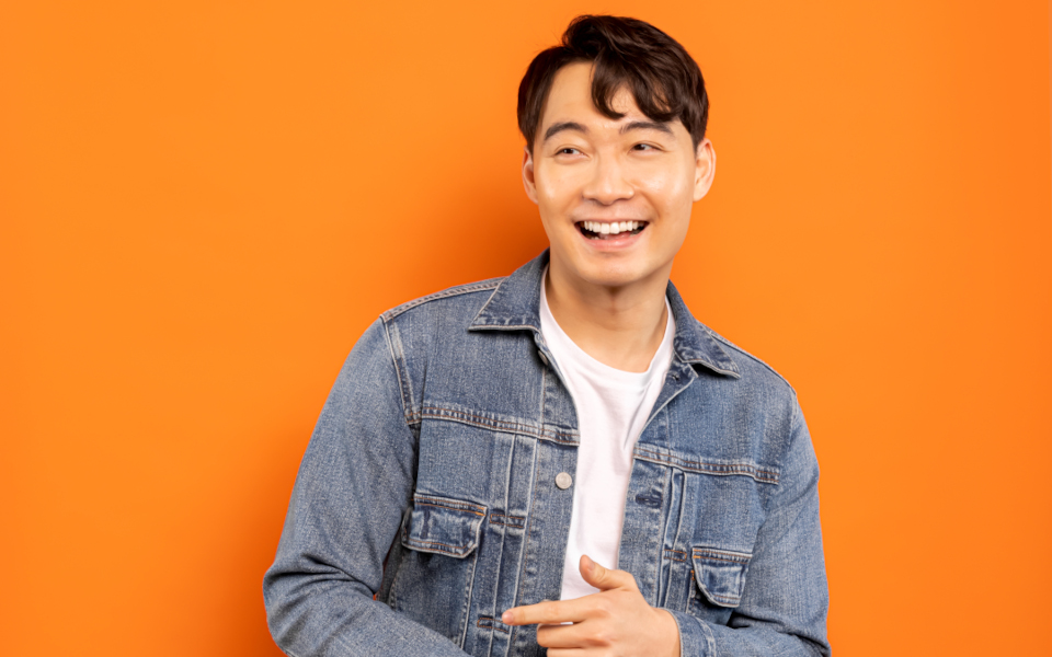 Nigel Ng Nigel Ng laughing, wearing a denim jacket