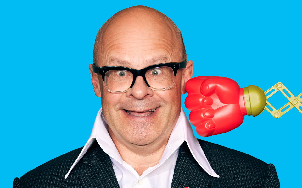 Harry Hill Harry Hill being punched by a retractable arm and boxing glove