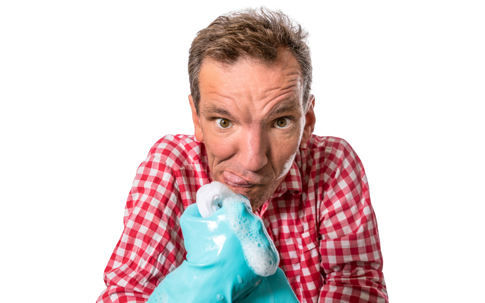 Henning Wehn Henning Wehn with rubber washing up gloves covered in soap suds pulling a funny face