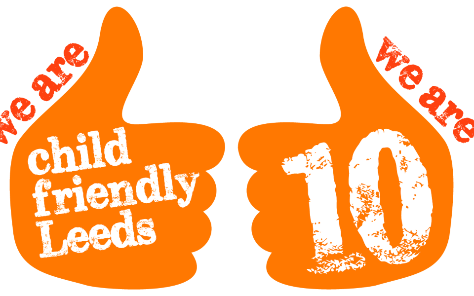 Child Friendly Leeds Logo Two orange thumbs up with Child Friendly Leeds and 10 written on them